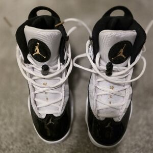 Jordan Kids Black and White Sneakers with Gold Accents